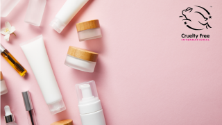 Cosmetics products on a pink background with the leaping bunny logo in the corner